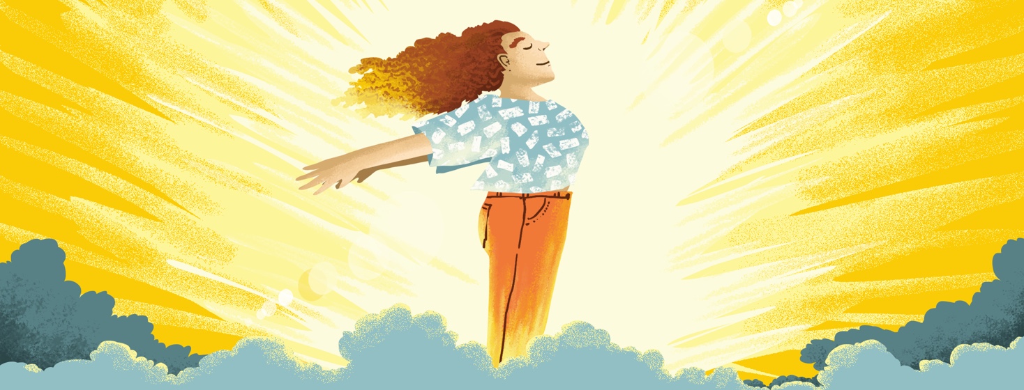 A woman standing proudly with her arms back in front of the sunshine